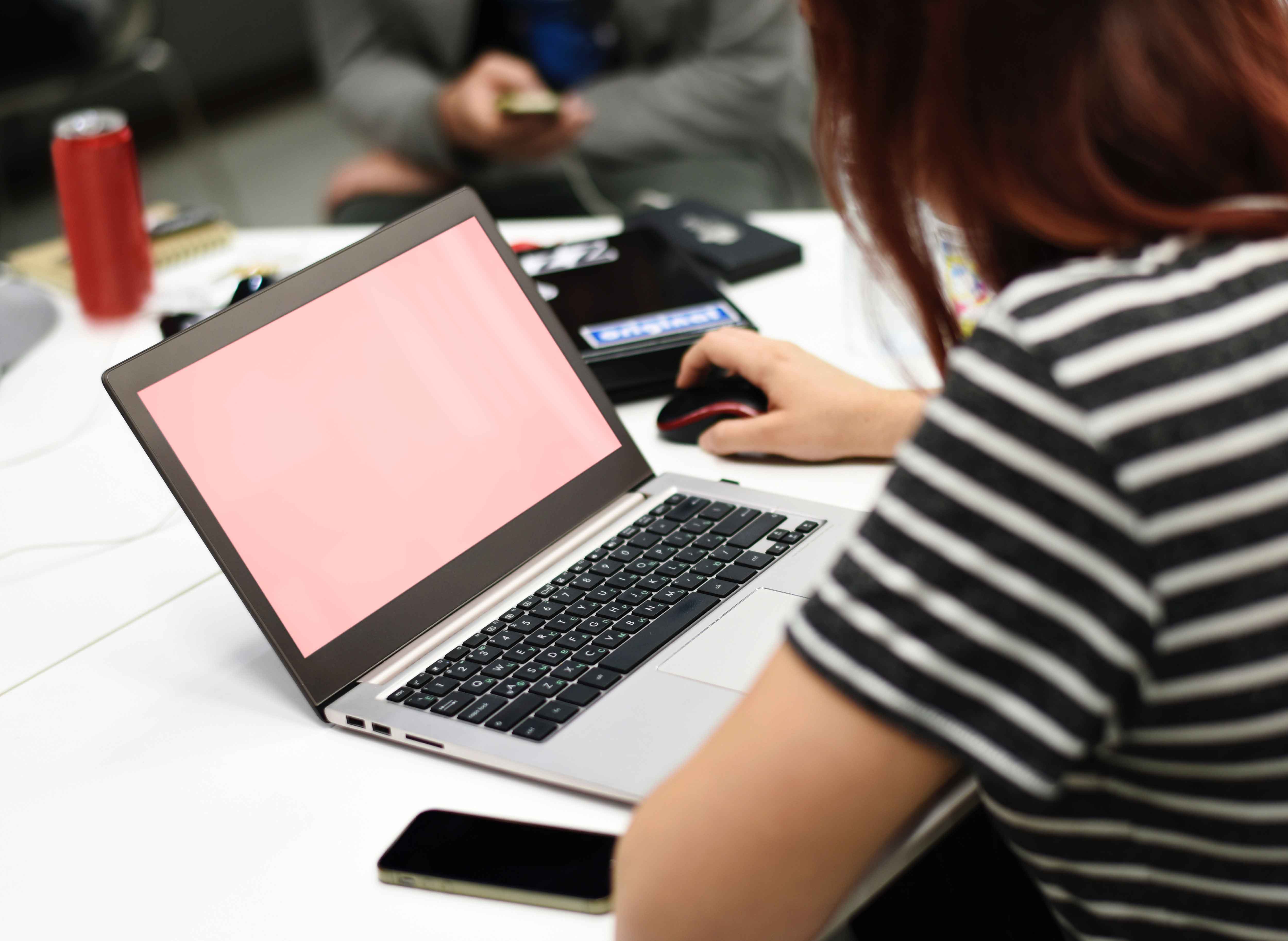 a girl looking at the laptop