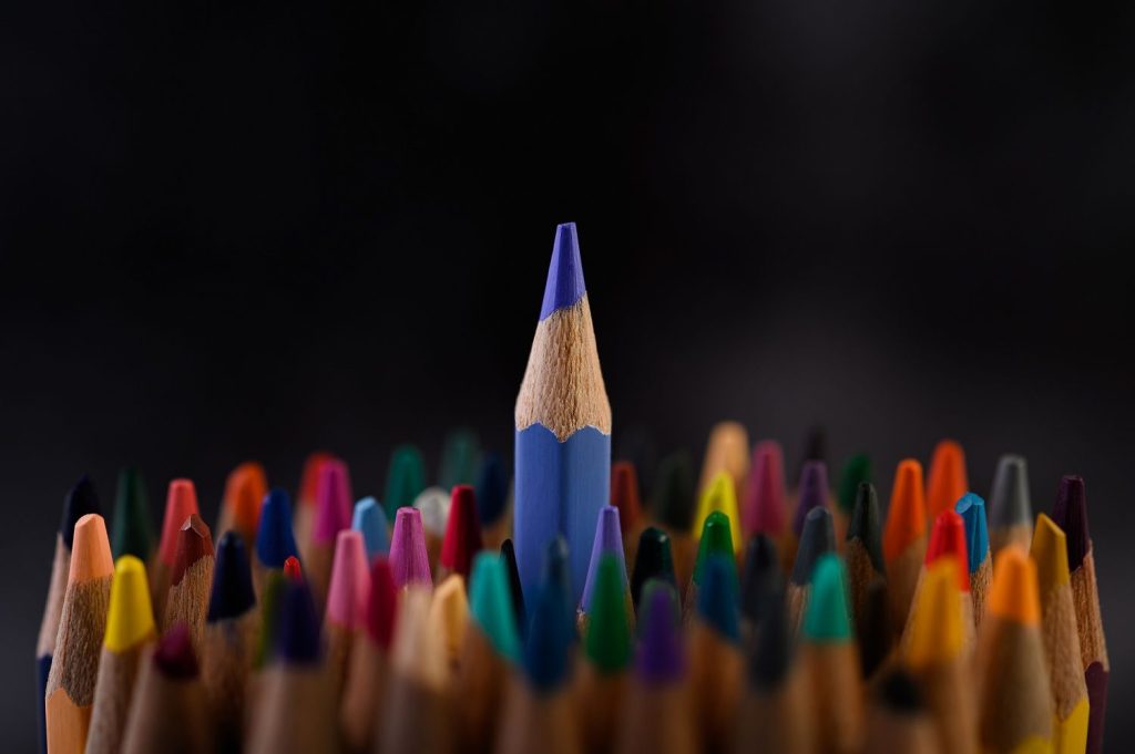 many color pencils on image