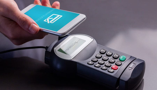 a man showing his smartphone for a cashless payment
